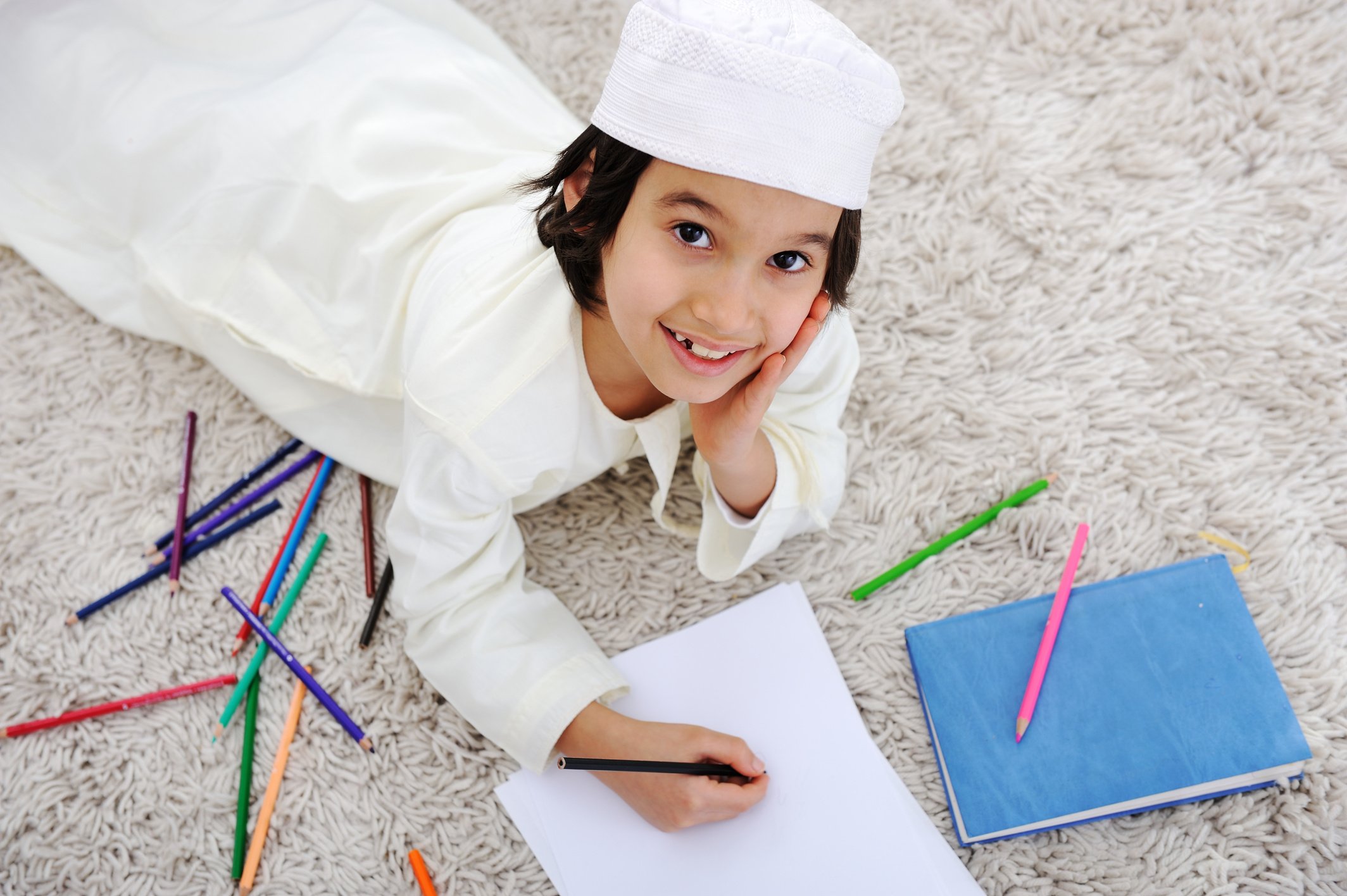 Arabian Muslim Kid Doing Homework at Home